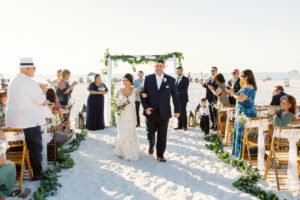 couple walking down the aisle during their wedding on clearwater beach