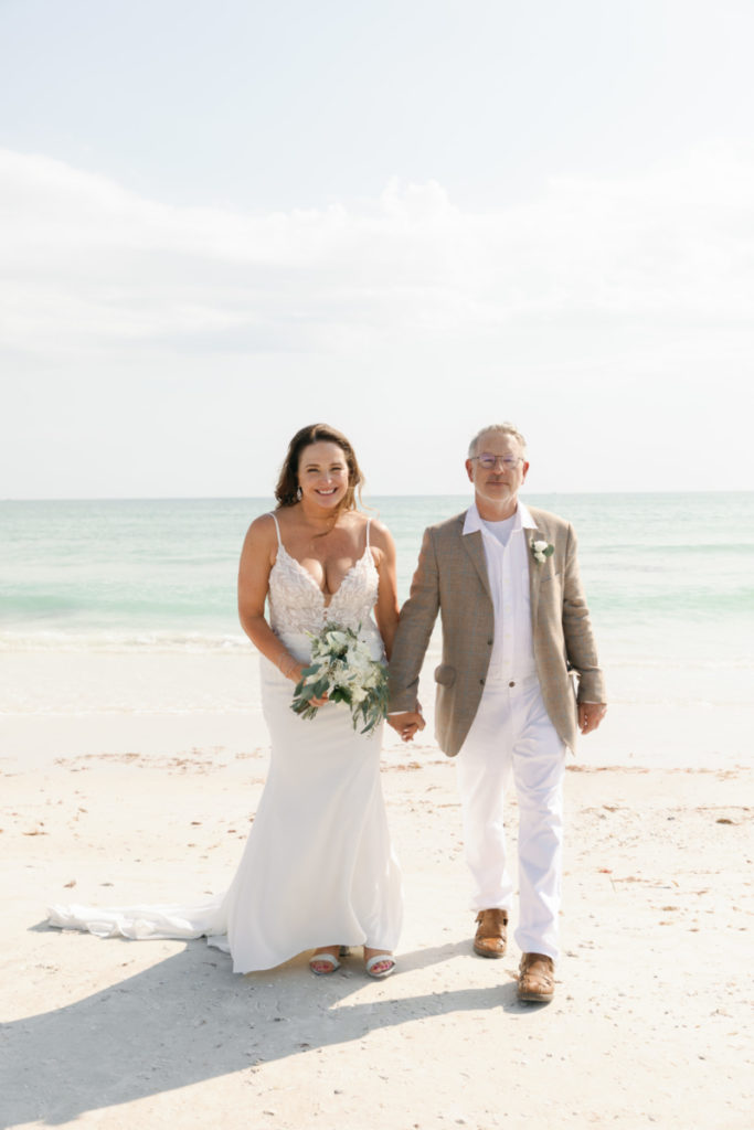 a bride and groom smiling after a florida beach elopement in st petersburg fl, florida beach wedding, beach elopement